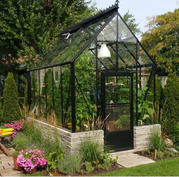 What is a freestanding greenhouse?